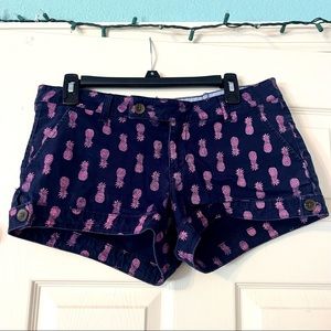 Size 11* dark blue shorts with pink pineapples
